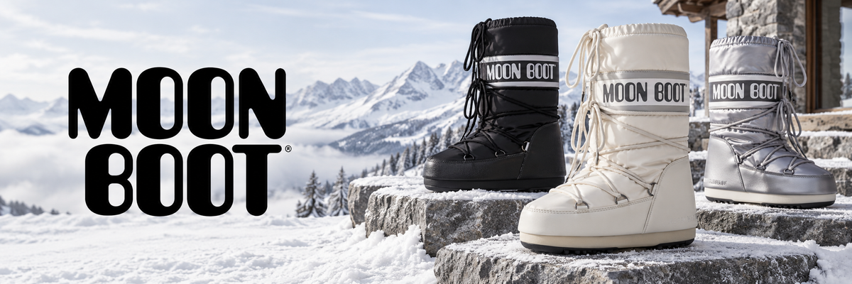 Moon Boot snowboots in zwart, wit en zilver in de sneeuw