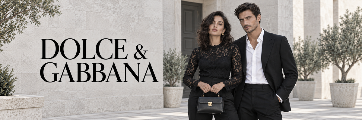 Dolce & Gabbana mode – vrouw in zwarte kanten jurk en man in zwart pak