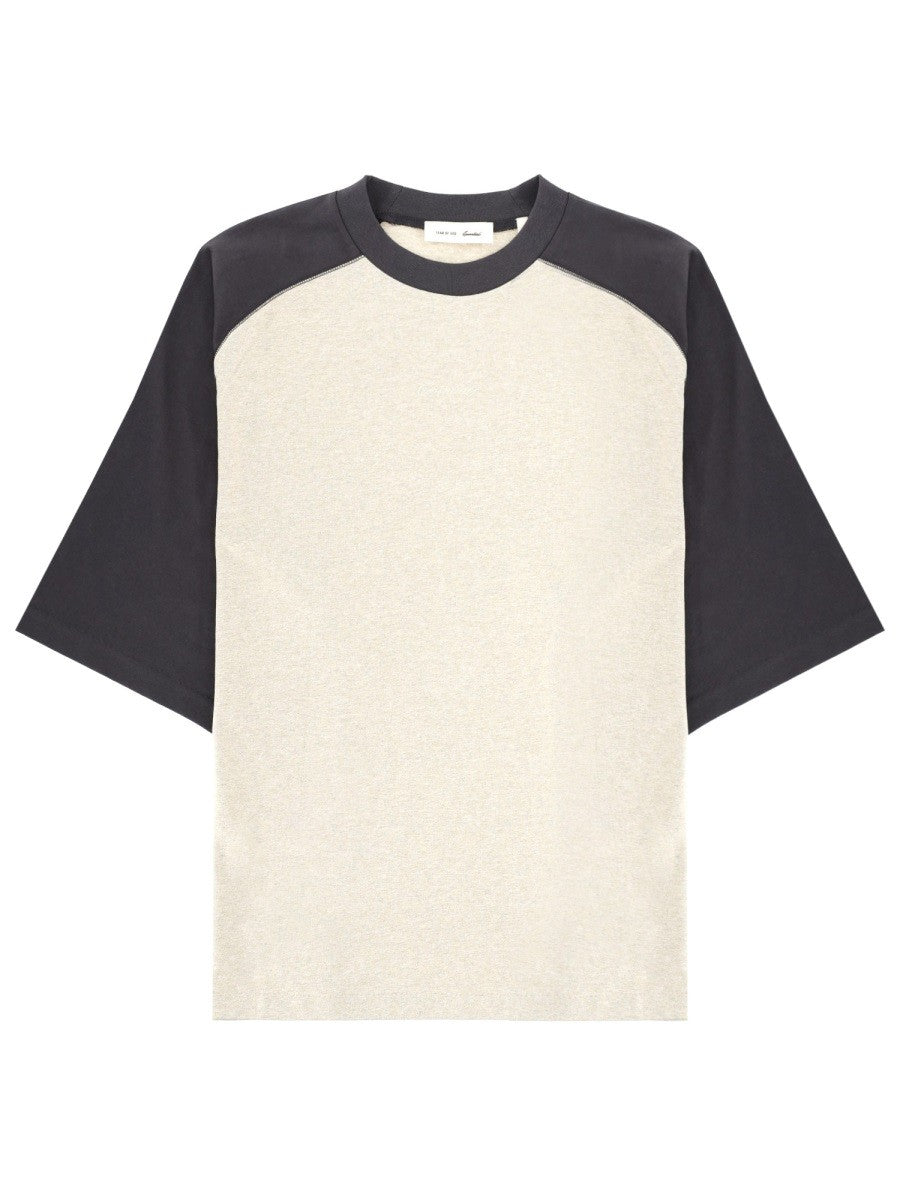 Fear of God Essentials T-shirt met raglanmouwen – Gebroken wit / Zwart