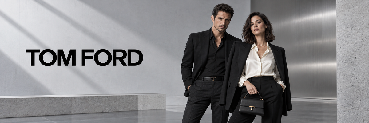 Tom Ford mode – man in zwart pak en vrouw in zwarte blazer met Tom Ford tas